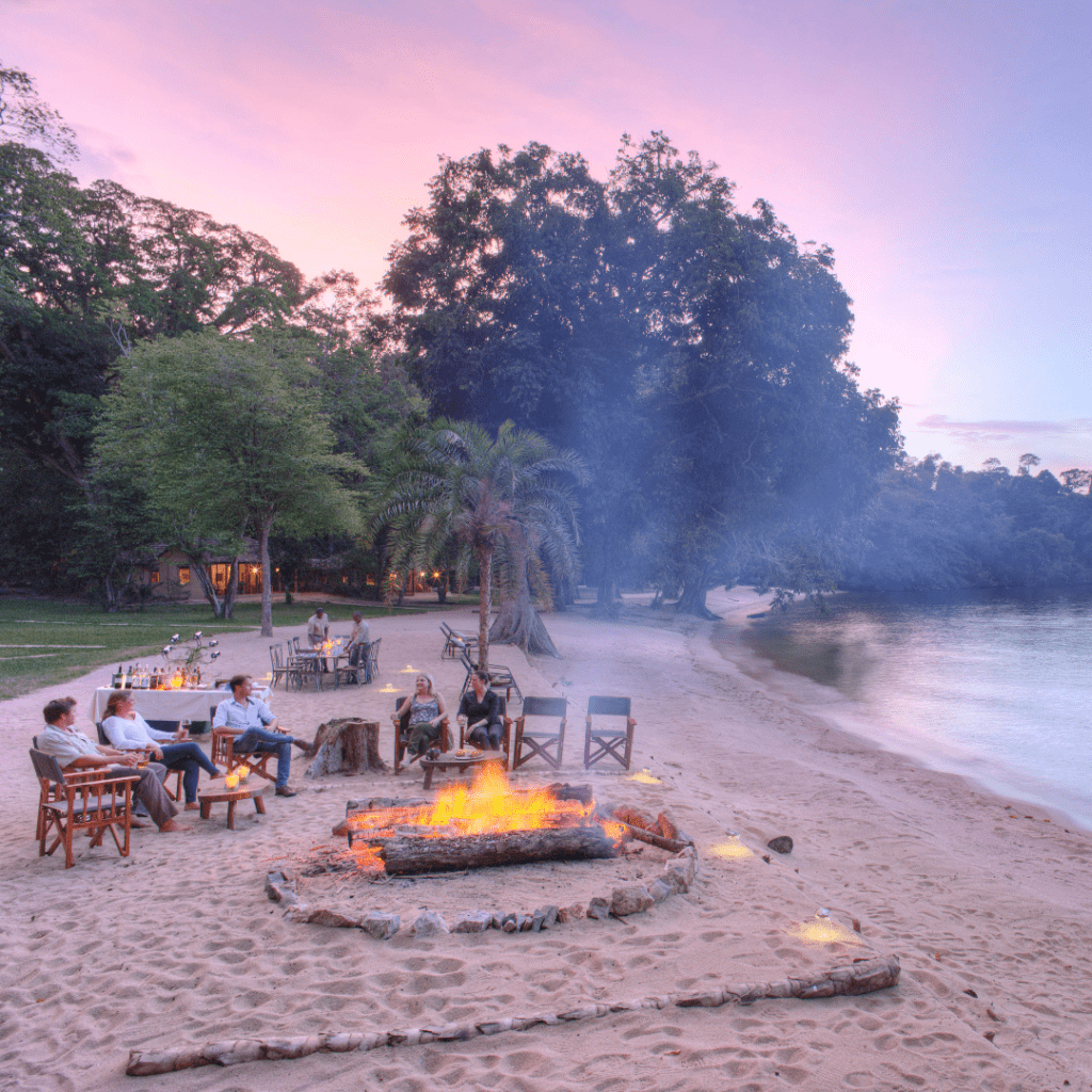 Tourists-seated-on-the-shore-of Rubondo-Island-during-sunset.