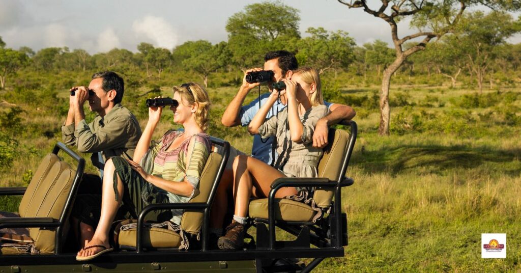 Group of tourists on safari sitting in jeep looking through binoculars